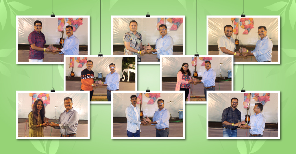 Amit Garg, CEO of Upside Learning, presenting awards to team members during the 19th Annual Party. Smiling faces filled with joy and pride as individuals are recognized for their outstanding contributions and achievements, fostering a culture of excellence and appreciation